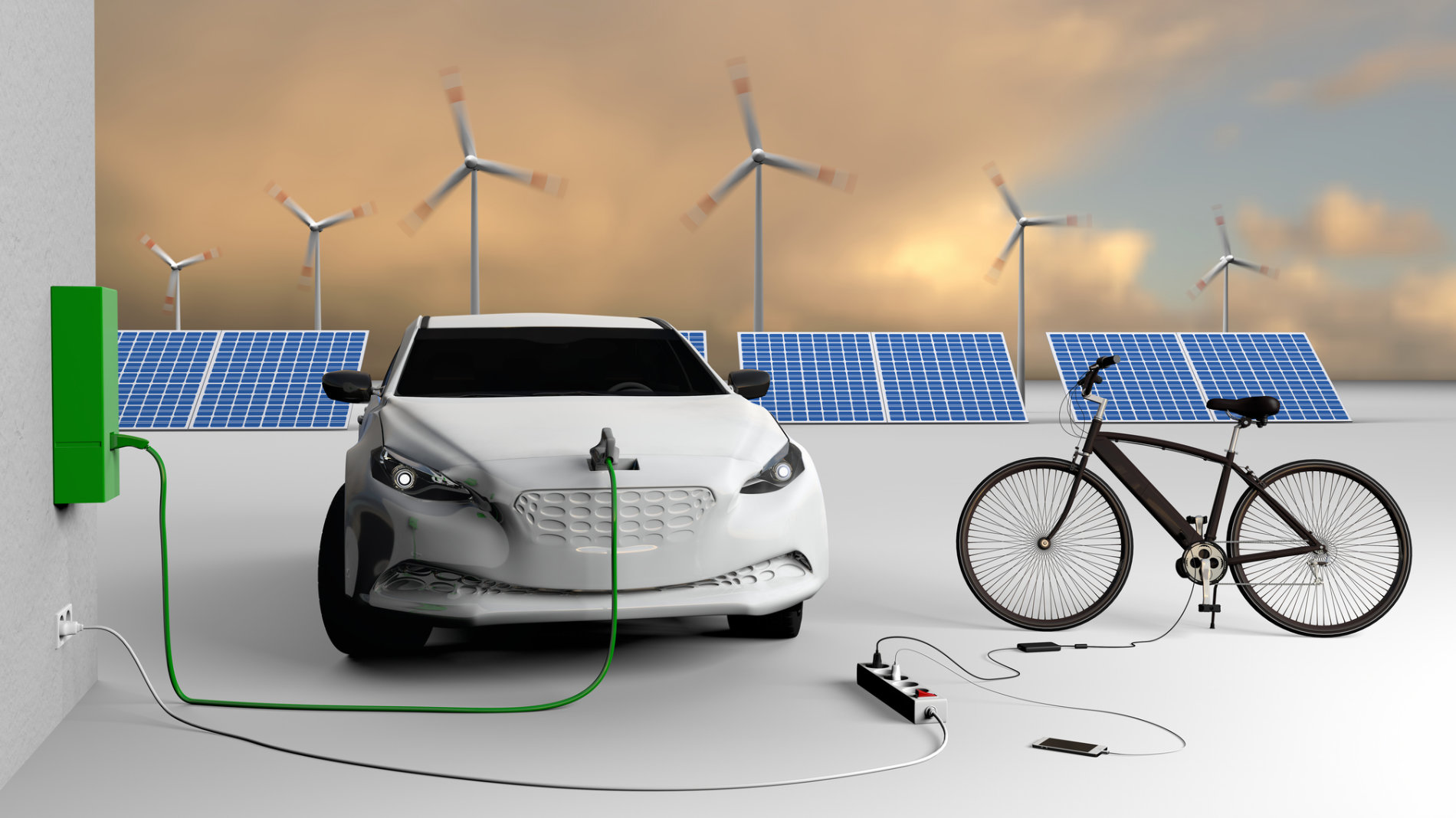 E-Auto hängt an einer Wallbox neben einem Fahrrad