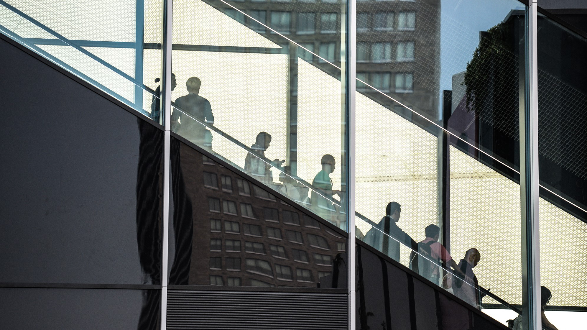 Trade fair visitors on an escalator